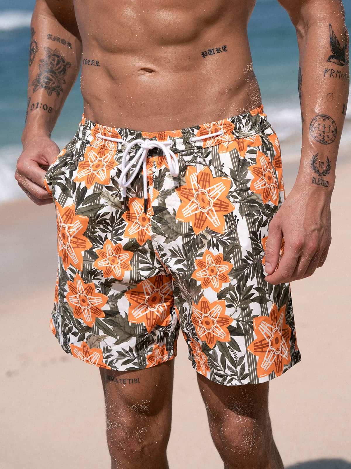 men_s-woven-polyester-swim-shorts-sustainable-men_s_beach_shorts-rto6bj Hapnix® - The Orange Floral Men's 7" Swim Trunks - Image 1