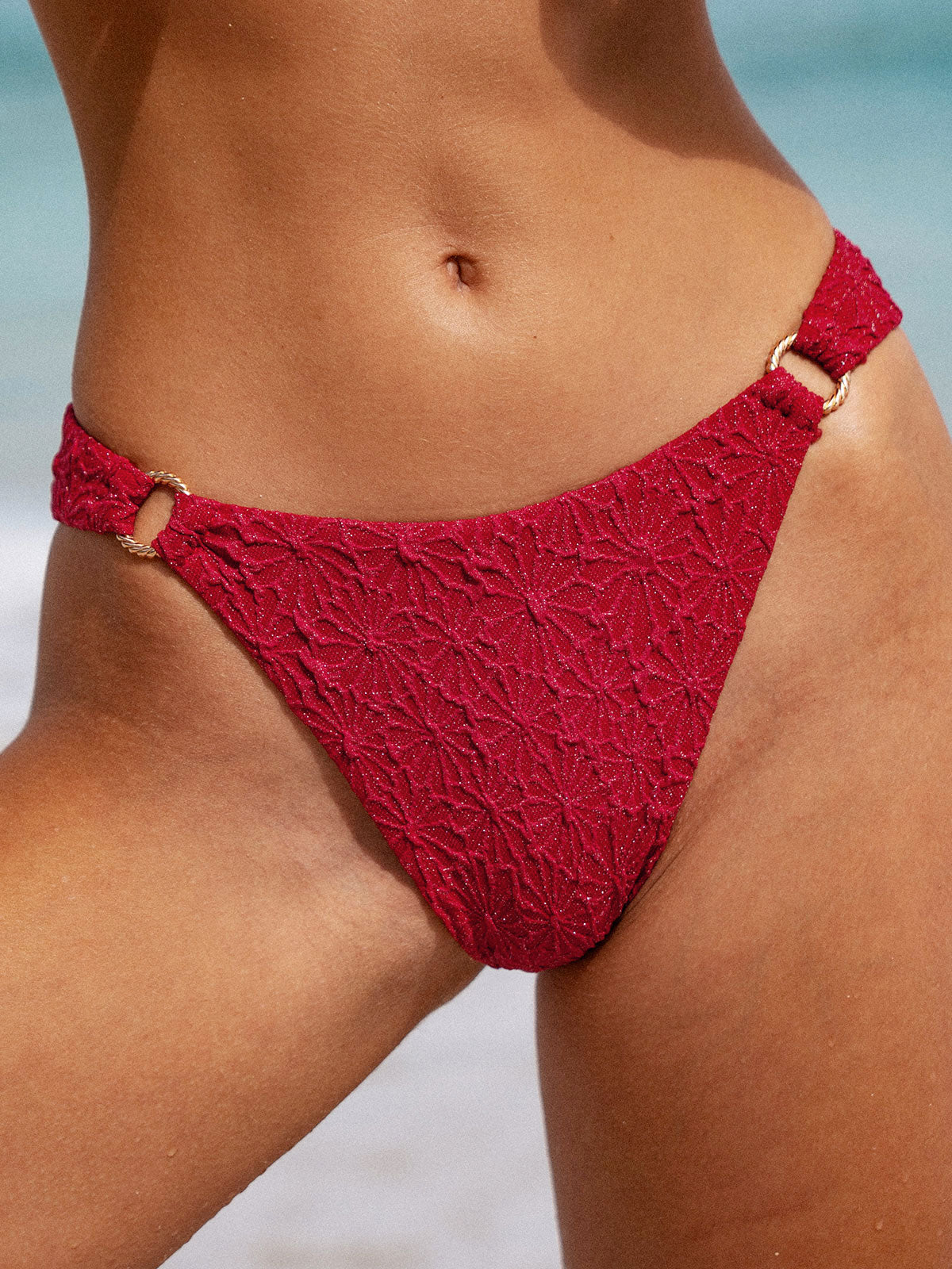 women-knitted-nylon-bikini-bottoms-sustainable-bikinis-765tqu Wine Red Textured O-Ring Bikini Bottom - Image 1