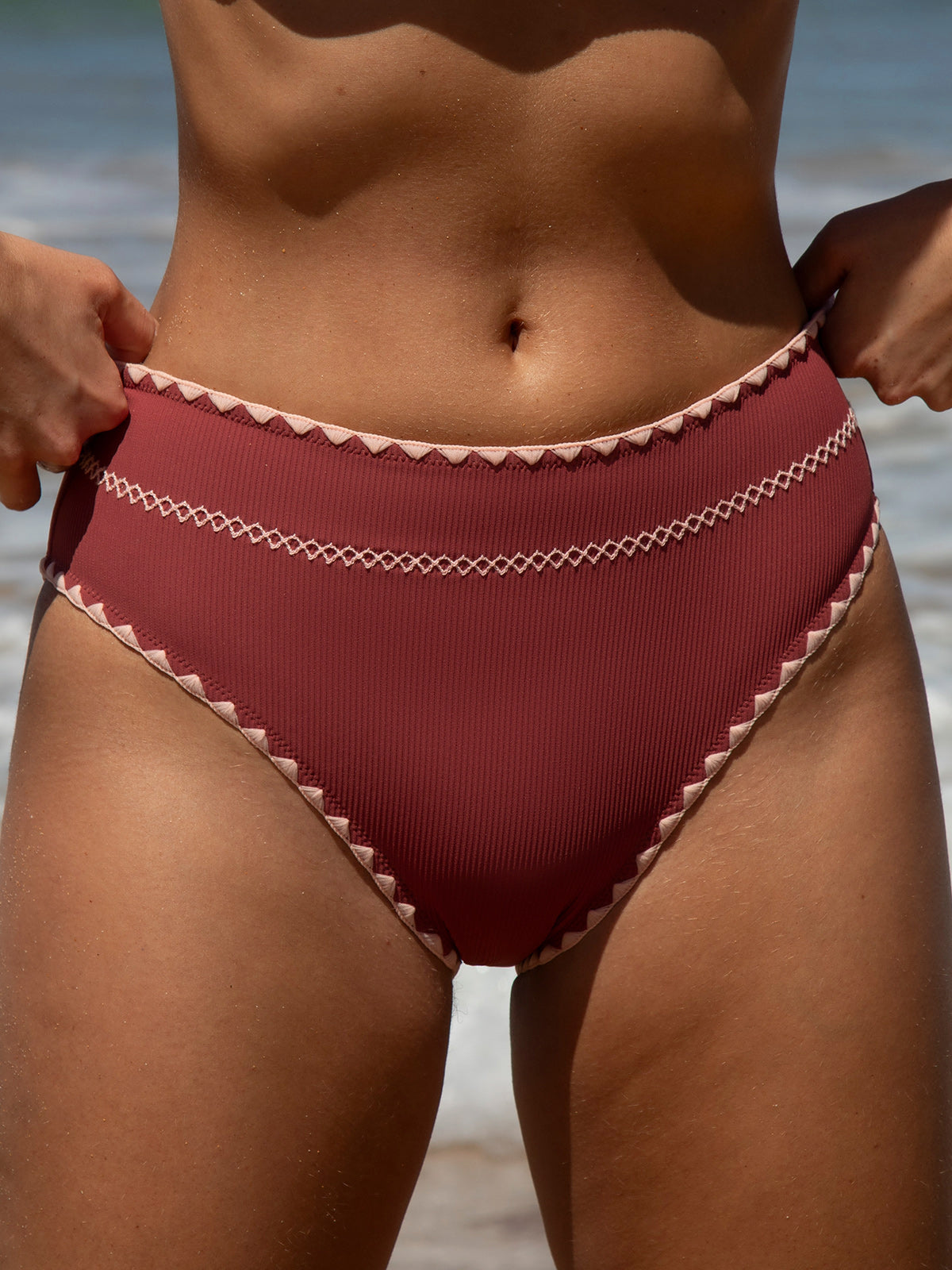women-knitted-nylon-blended-bikini-bottoms-sustainable-bikinis-2e2gga Brick Red Contrast Stitch Bikini Bottom - Image 1