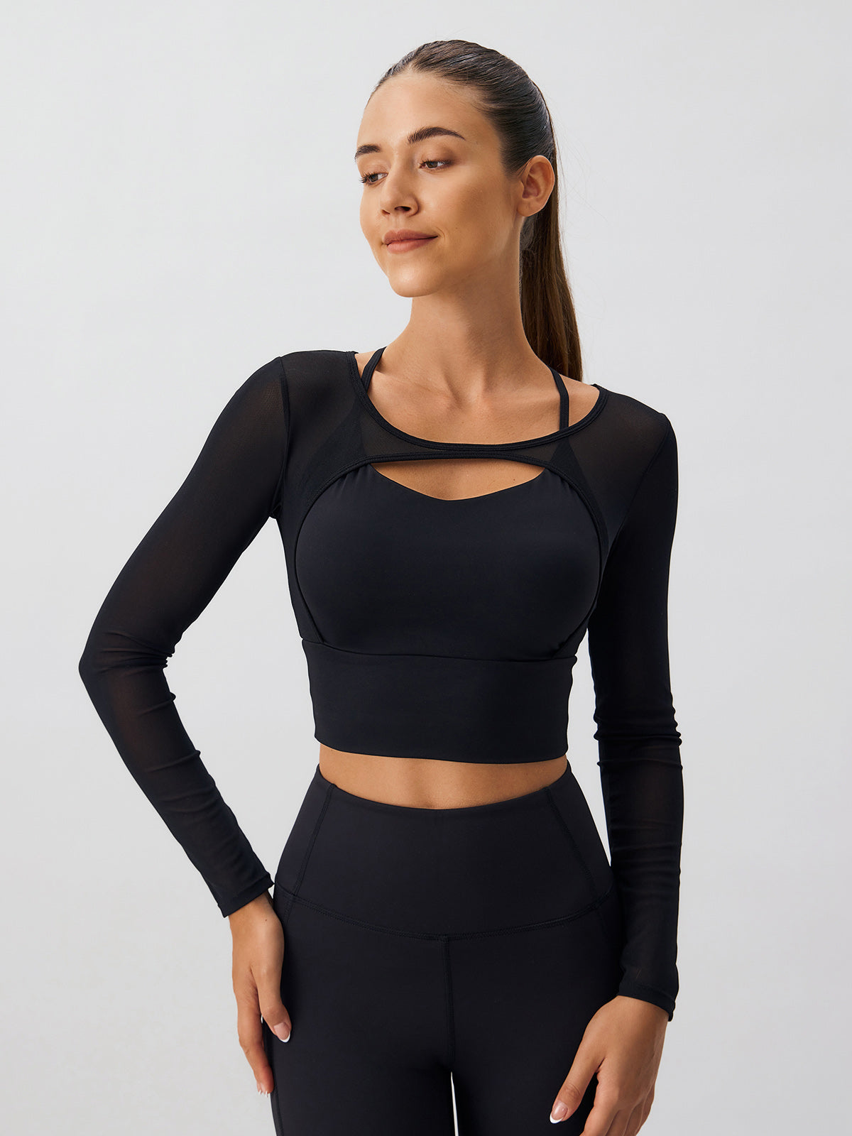 women-knitted-nylon-yoga-long-sleeve-tops-sustainable-yoga_tops-livo9t Black Cut Out Long Sleeve Top--Light Support - Image 1