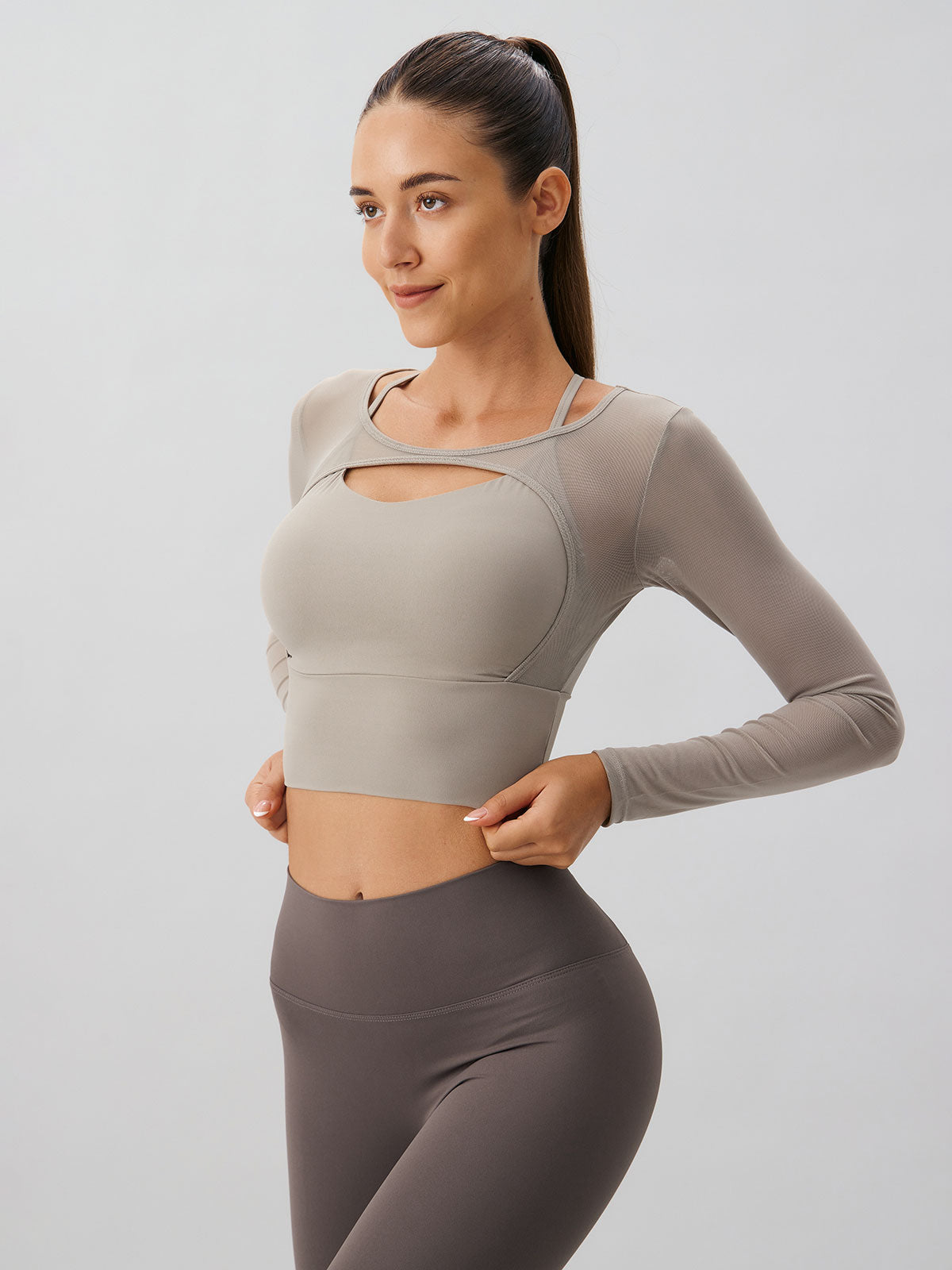 women-knitted-nylon-yoga-long-sleeve-tops-sustainable-yoga_tops-tlhmel Khaki Cut Out Long Sleeve Top--Light Support - Image 1