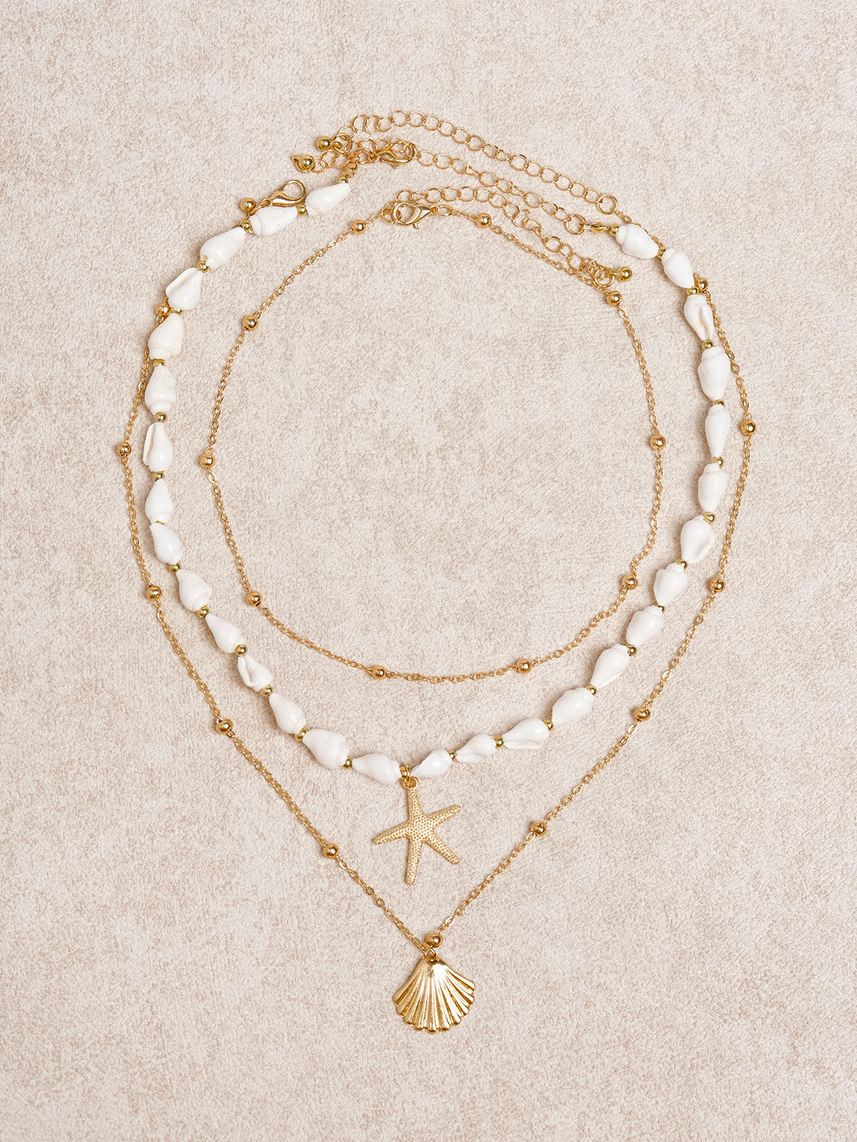 women_s-alloy-conch-necklace-gold-sustainable-necklaces-r3vkuj Gold Seashell Layered Necklace - Image 1