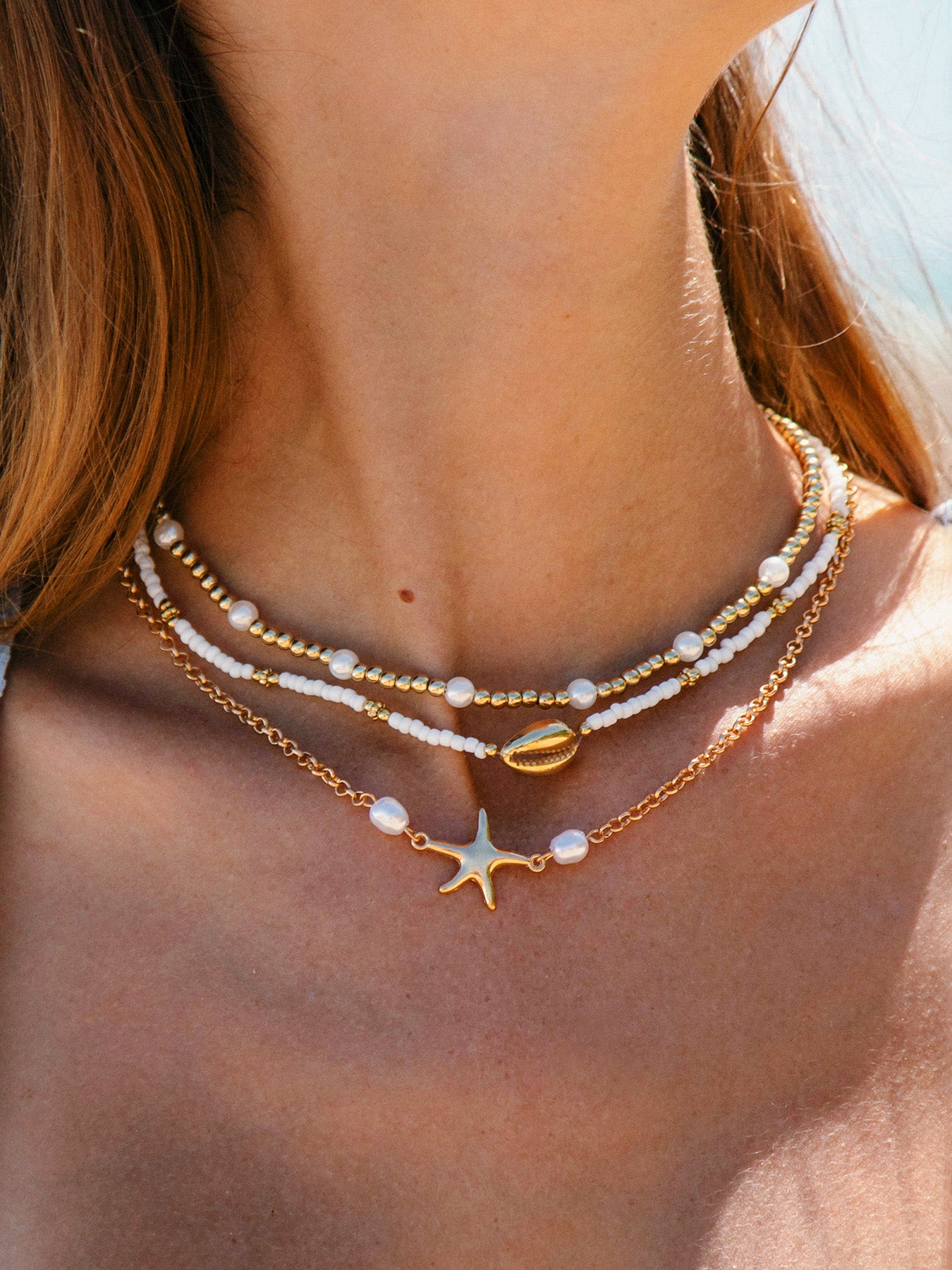 women_s-alloy-starfish-pearl-necklace-sustainable-necklaces-xlt52e Gold Alloy Starfish Pearl Necklace - Image 1