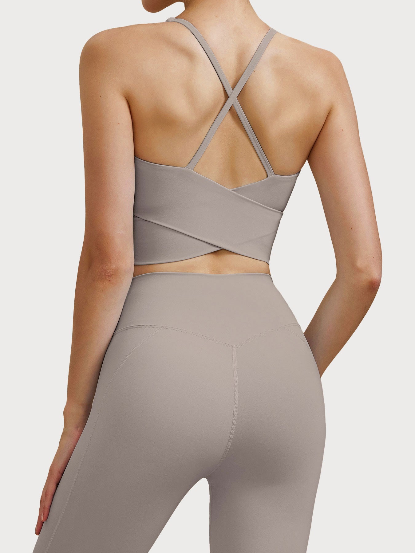 women_s-knitted-nylon-sports-bra-apricot-sustainable-yoga_tops-tm9ffa Apricot V Neck X-Cross Sports Bra - Medium Support - Image 1