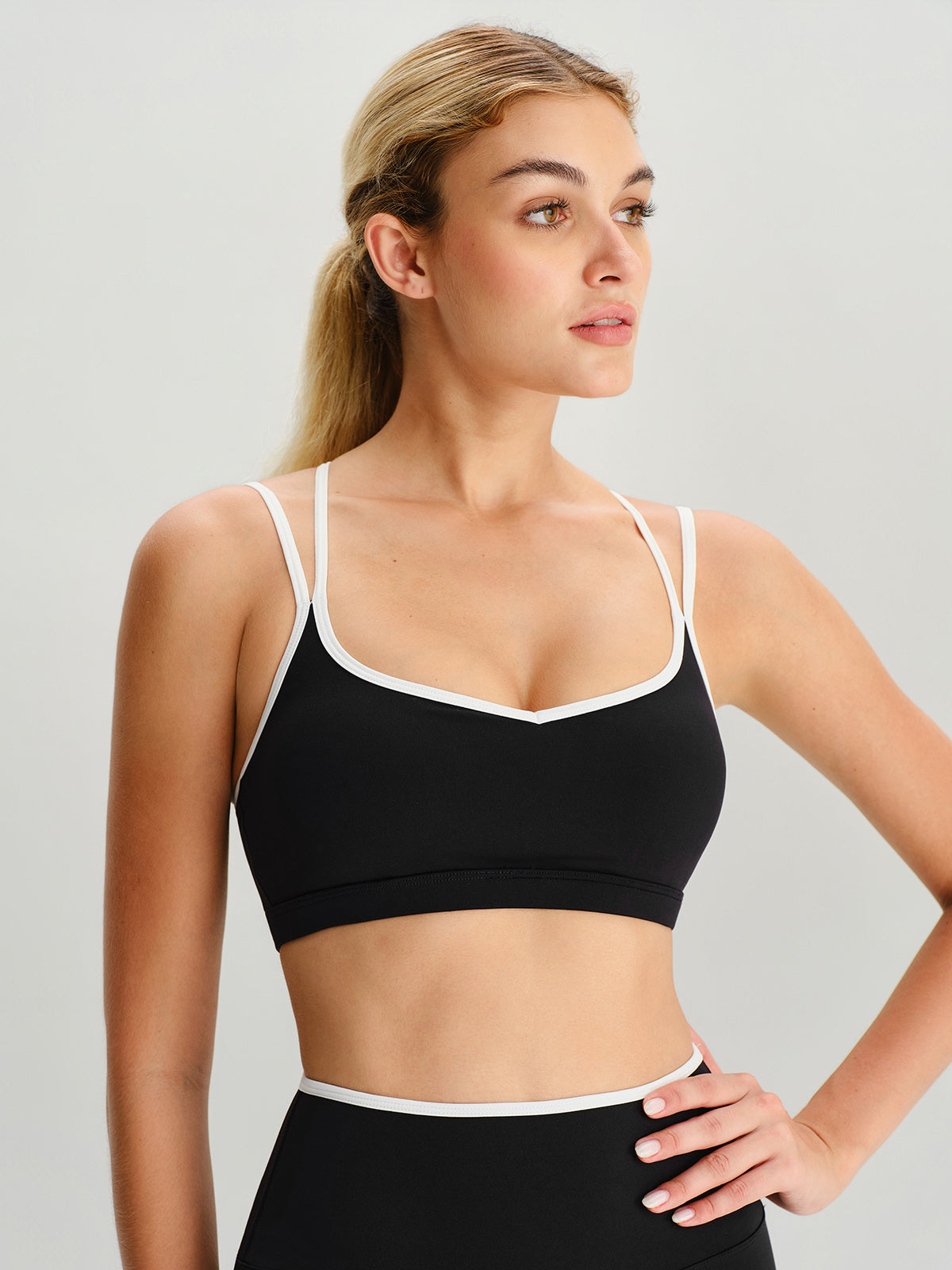women_s-knitted-nylon-sports-bras-sustainable-yoga_tops-b2bhif Black X Cross Sports Bra - Light Support - Image 1