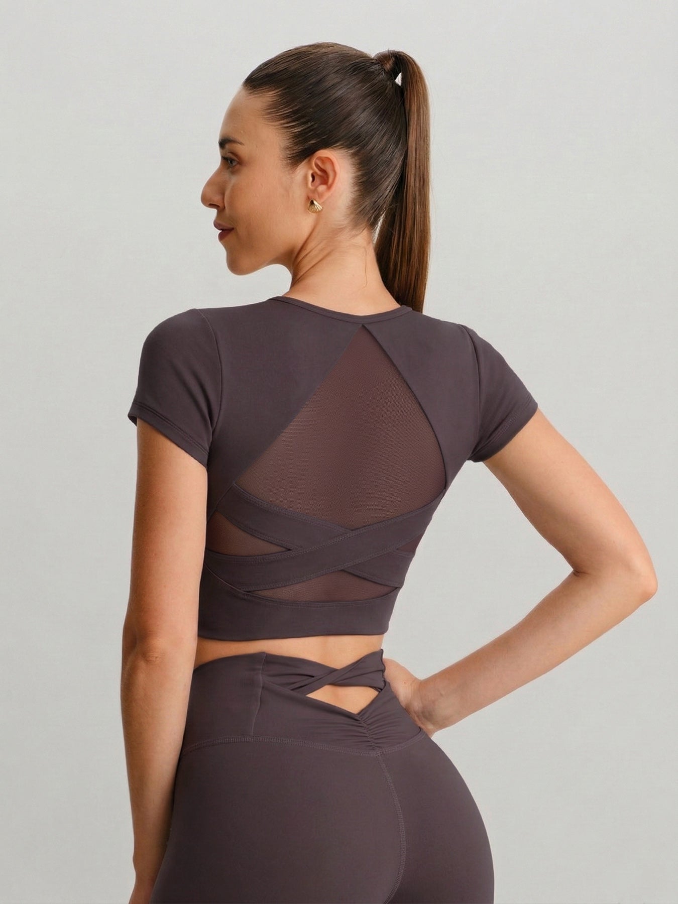 women_s-knitted-nylon-yoga-short-sleeve-tops-sustainable-yoga_tops-defthd Purple Cross Mesh Back Short Sleeve Top-Light Support - Image 1