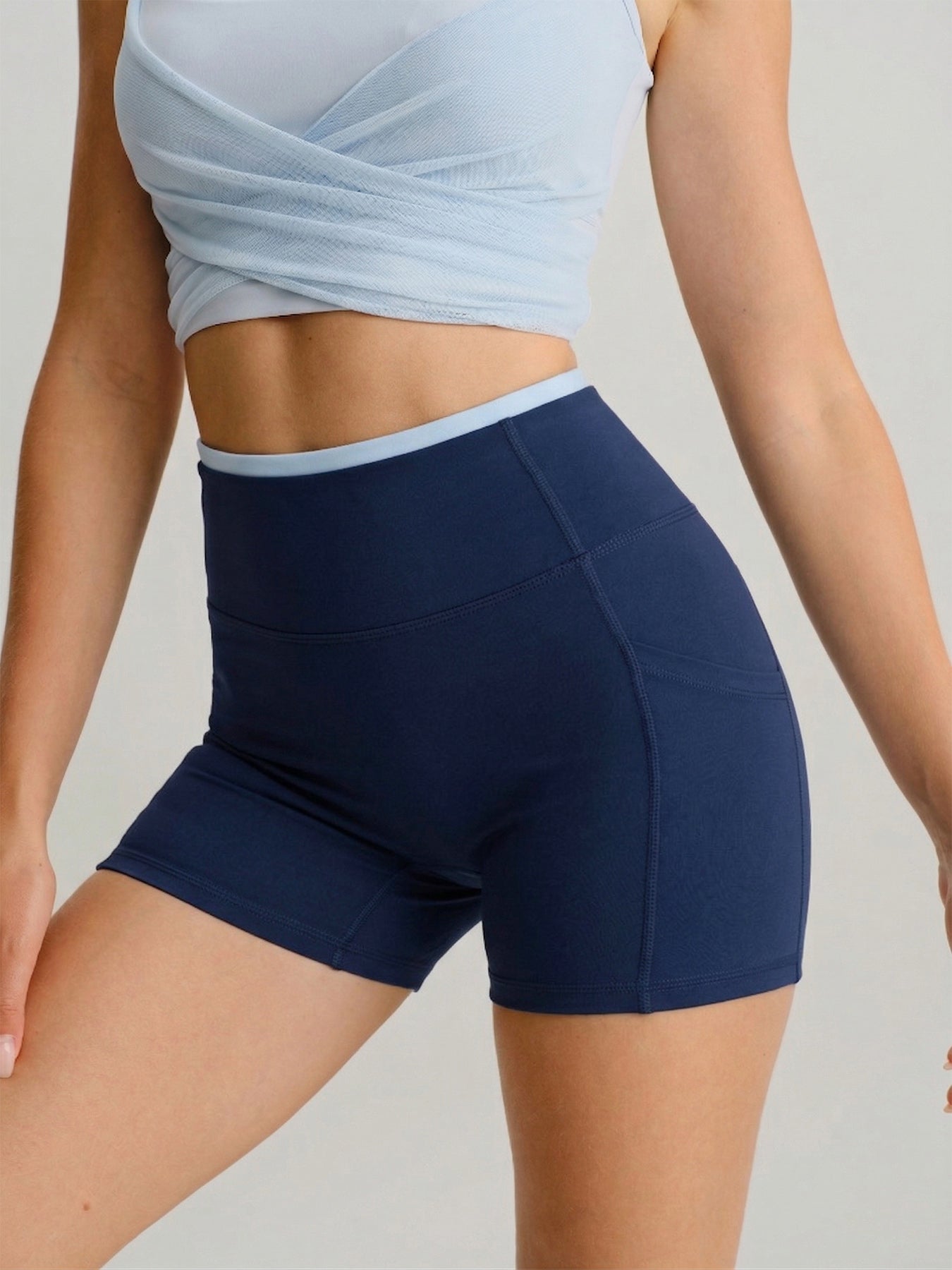 women_s-knitted-nylon-yoga-shorts-navy-sustainable-yoga_bottoms-vjfpsy Navy High-Waist Pocket Biker Shorts 3" - Image 1