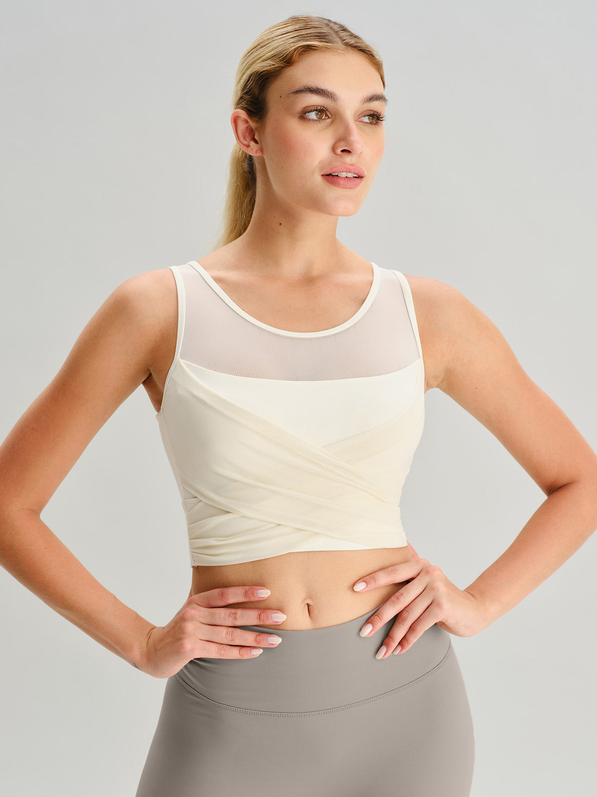 women_s-knitted-nylon-yoga-tank-top-sustainable-yoga_tops-bv81jd Beige Mesh Cross-Front Tank Top - Light Support - Image 1